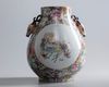 A Chinese gilt-ground famille rose millefleurs deer-head handled pear shaped vase, hu