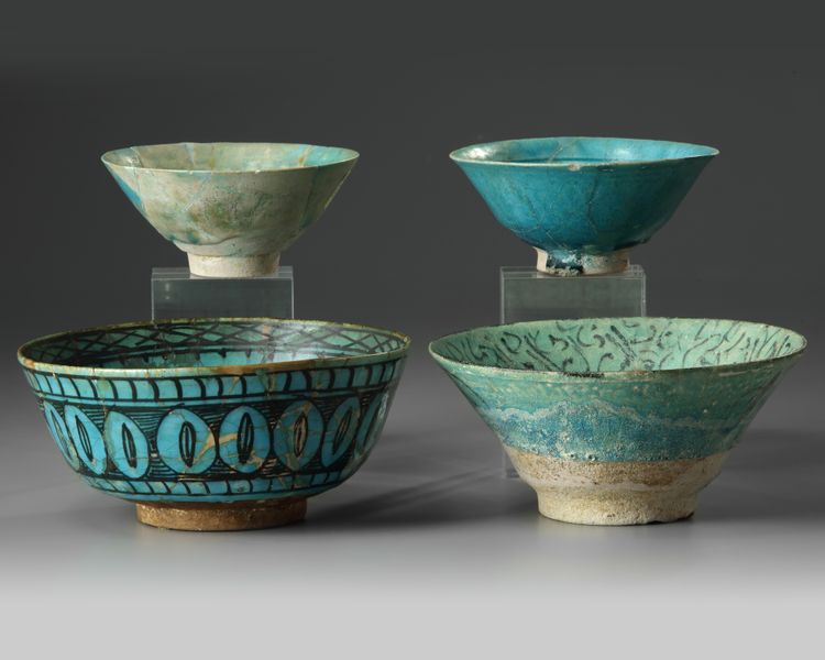 Four Islamic turquoise glazed bowls
