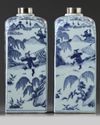 A pair of Chinese blue and white square bottles and silver covers