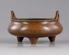 A Chinese bronze tripod censer