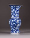 A Chinese blue and white 'prunus on cracked ice' phoenix tail vase