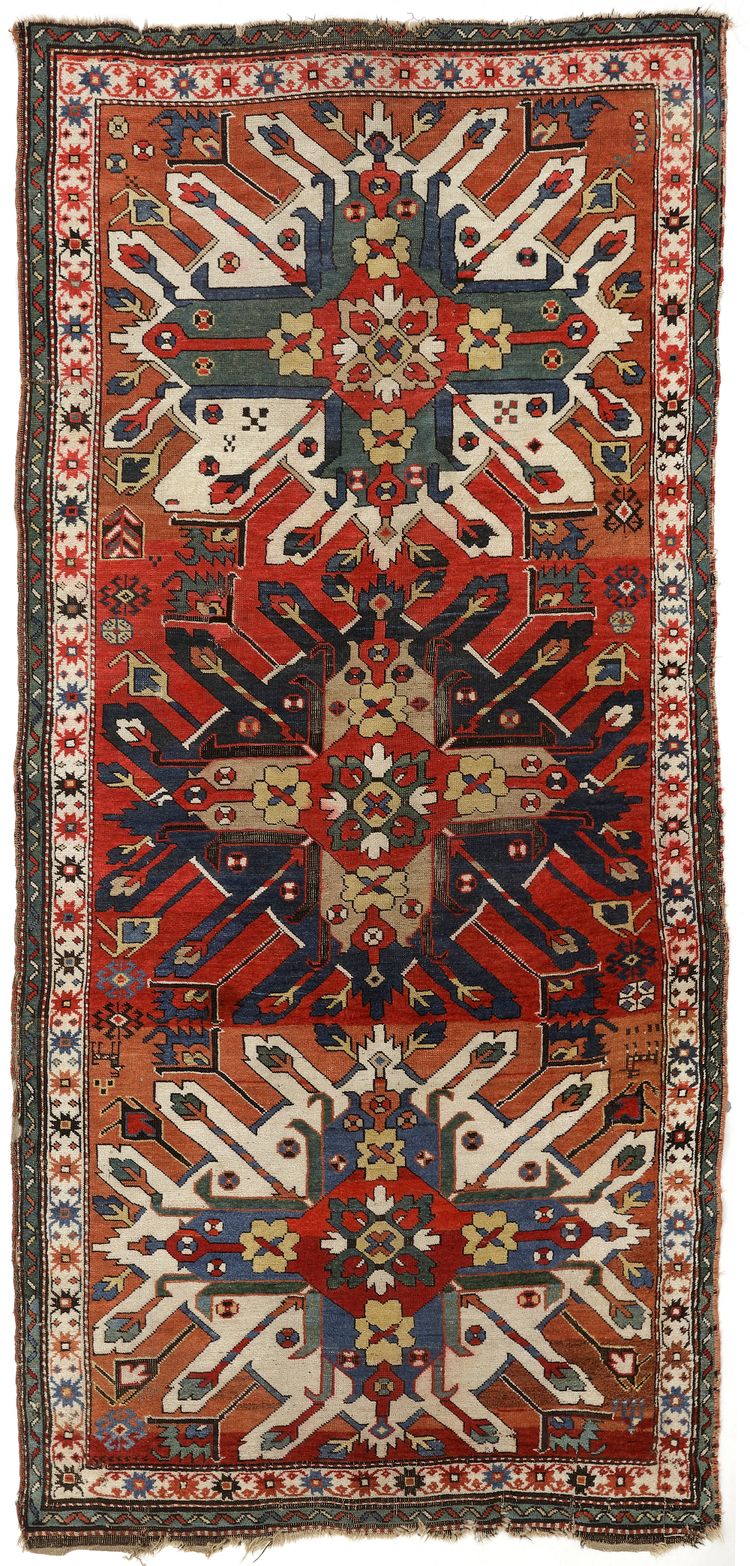 AN ADLER KAZAK CARPET.