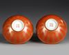 A PAIR OF CHINESE RED GLAZED BOWLS WITH CHARACTERS, 19TH CENTURY
