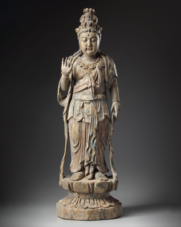A large Chinese polychrome-decorated wood carving of Guanyin