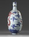 A Chinese underglaze blue and copper-red-decorated 'dragon' moonflask