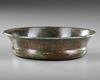 AN ACHAEMENID BRONZE LOTUS PHIALE, CIRCA 6TH-5TH CENTURY B.C.