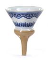 A CHINESE CAFÉ-AU-LAIT GLAZED BLUE AND WHITE FUNNEL