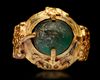 A GREEN STONE SET GOLD RING