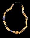 A MIXED ANCIENT-STYLE GLASS BEAD STRAND