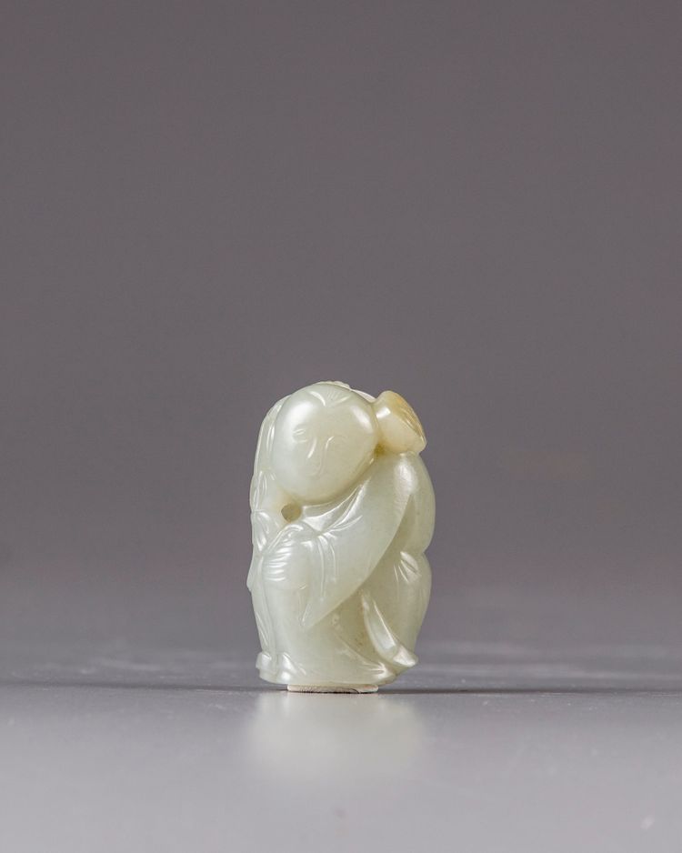 A Chinese jade carving of a boy