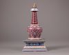 A Chinese ruby red-ground famille rose stupa