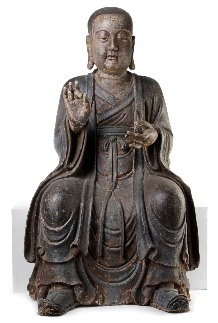 A CHINESE POLYCHROME-DECORATED WOOD LUOHAN, LATE MING DYNASTY, 17TH CENTURY