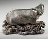 A CHINESE BRONZE BUFFALO ON A STAND, MING DYNASTY (1368-1644)