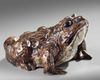 A Japanese ceramic figure of a frog