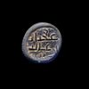AN EARLY ISLAMIC GLASS WEIGHT OF HALF DIRHAM, 10TH-11TH CENTURY