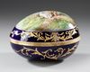 AN EGG SHAPED LIMOGES PORCELAIN JEWELRY BOX, SIGNED, LATE 19TH CENTURY