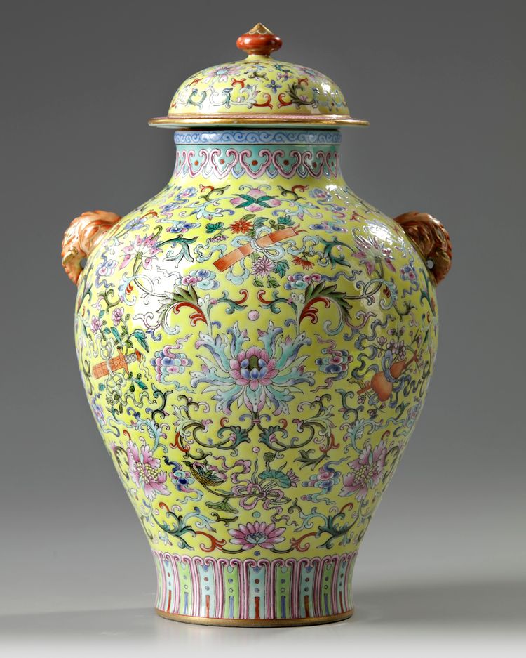 A Chinese yellow-ground famille rose 'Eight Immortals' vase and cover