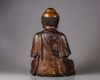 A Chinese parcel-gilt bronze figure of a monk