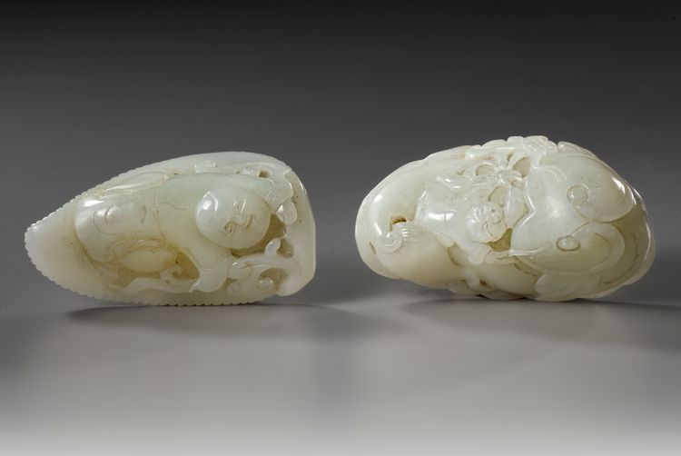 TWO LARGE CHINESE PALE CELADON JADE 'BOYS' CARVINGS, 20TH CENTURY