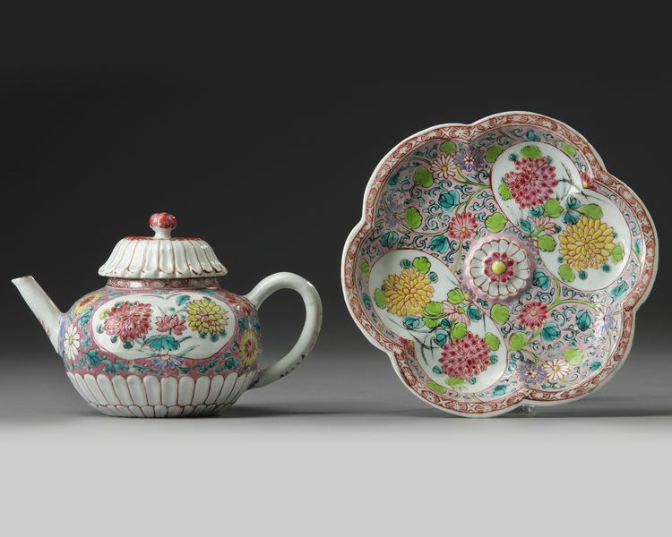 A CHINESE PINK-GROUND FAMILLE ROSE MOULDED 'CHRYSANTHEMUM' TEAPOT, COVER AND STAND