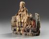 A Chinese soapstone figure of a seated Luohan