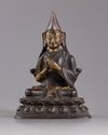A CHINESE GILT BRONZE FIGURE OF LAMA