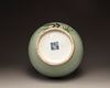A Chinese celadon-ground famille rose bottle vase