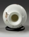 A small Chinese famille rose 'bird and lotus' bottle vase