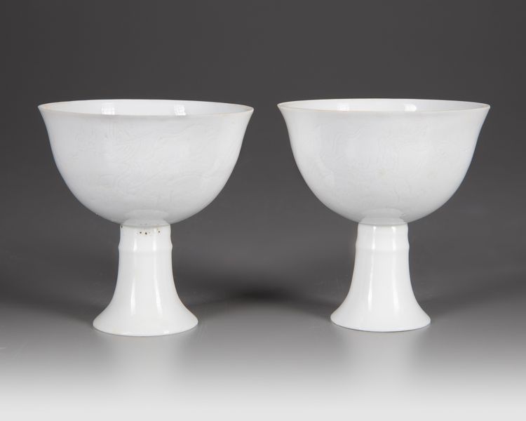 A PAIR OF CHINESE WHITE-GLAZED DRAGONS STEM CUPS, 20TH CENTURY