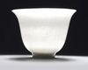 A Chinese white-glazed 'phoenix' cup