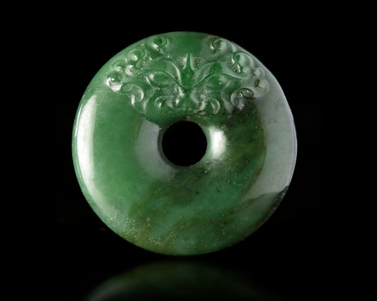 A CHINESE SPINACH JADE CARVED DISC PENDANT, 20TH CENTURY