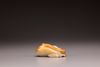 A white and russet jade magnolia carving