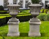 A PAIR OF LARGE SCULPTED LIMESTONE GARDEN URNS,  20TH CENTURY
