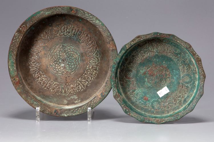 Two Islamic bronze dishes