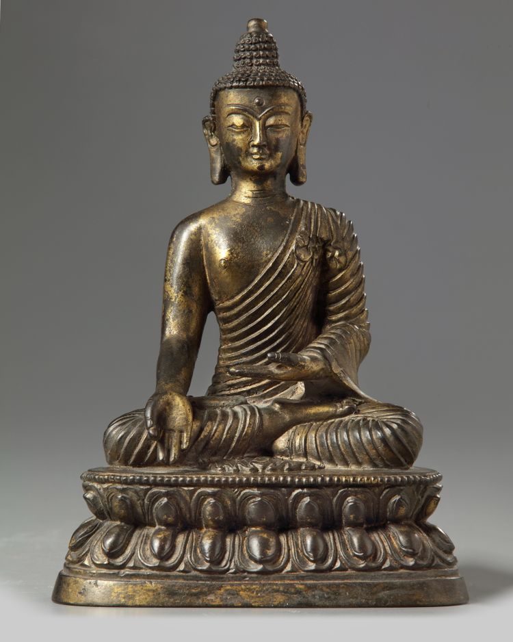 A Chinese bronze figure of buddha