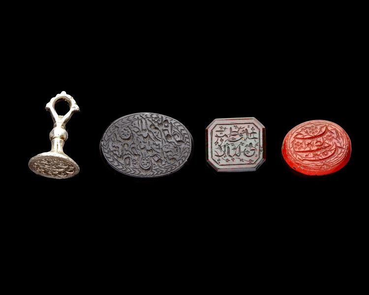 FOUR PERSIAN AGATE AND SILVER SEALS, QAJAR PERIOD, 19TH CENTURY
