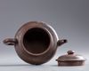 A Chinese Yixing 'landscape' teapot and cover