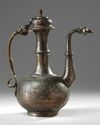 A TINNED COPPER CALLIGRAPHY EWER