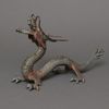 A JAPANESE CAST-IRON OKIMONO DRAGON, MID 20TH CENTURY
