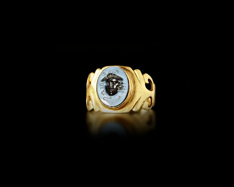 A ROMAN GOLD OPENWORK RING WITH NICOLO INTAGLIO, 2ND-3ND CENTURY AD