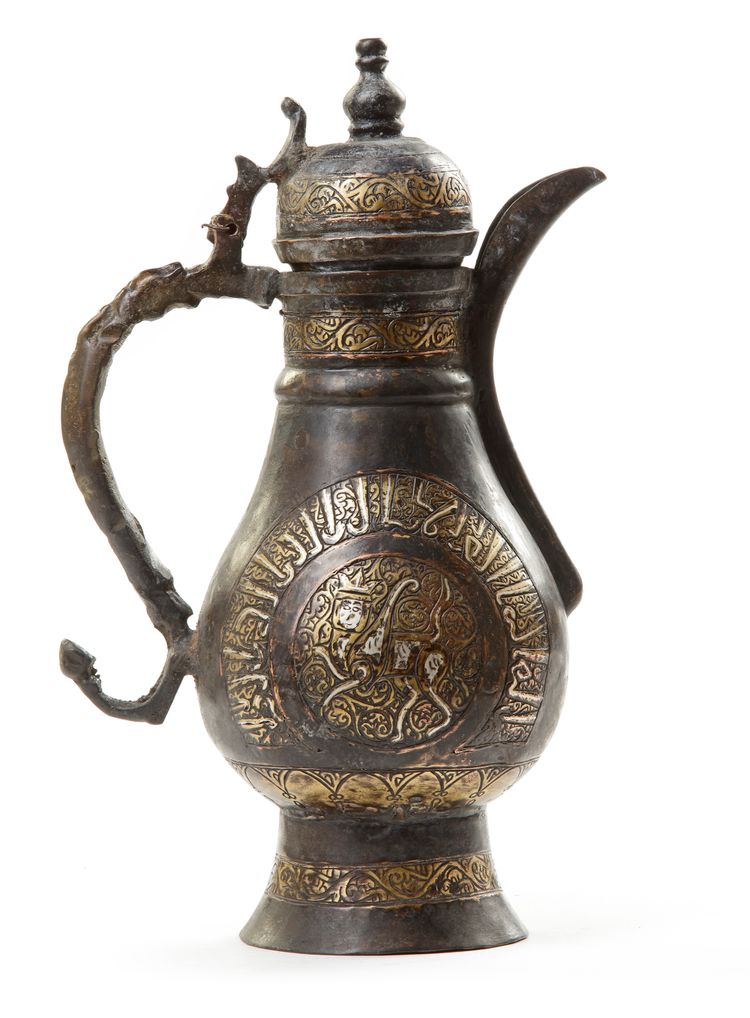 A PERSIAN SILVER INLAID COPPER EWER