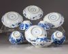 Five blue and white cups and saucers