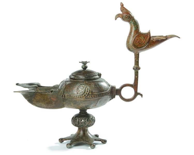 A BRONZE OIL LAMP, KHORASAN, EASTERN PERSIA, 12TH CENTURY
