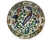AN IZNIK POTTERY DISH WITH QUATRE FLEURS DECORATION, OTTOMAN TURKEY, 16TH CENTURY