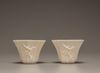 A pair of white-glazed octagonal 'prunus' cups