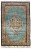 A SIGNED SILK TURKISH HEREKE RUG, 1950