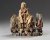 A Chinese soapstone figure of a seated Luohan