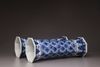 A pair of blue and white trumpet vases