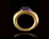 A ROMAN GOLD RING WITH AN AMETHYST CABOCHON INTAGLIO, 1ST CENTURY BC/AD