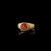 A HOLLOW ROMAN GOLD RING WITH A GARNET INTAGLIO OF AN EAGLE'S HEAD, 1ST CENTURY AD